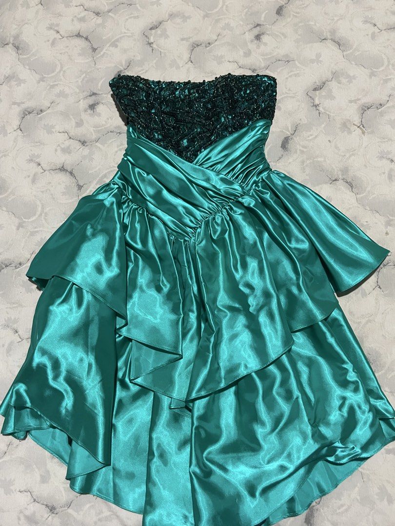 Crazy Rich Asians Inspired Dress (Category: Dresses) located in Manila. Submitted by stargirl05 (Listing ID 1445381277, Image 2). Description: Strapless sequin bodice Boned, lined bodice Straight across neckline Black sparkly metallic top Teal blue green sequins Center back zipper Basque waist, gathered skirt Criss cross cummerbund Back loop bow, snap Two tiered full skirt Pointed in front, raised sides True full circle skirt Tulle layer under fu