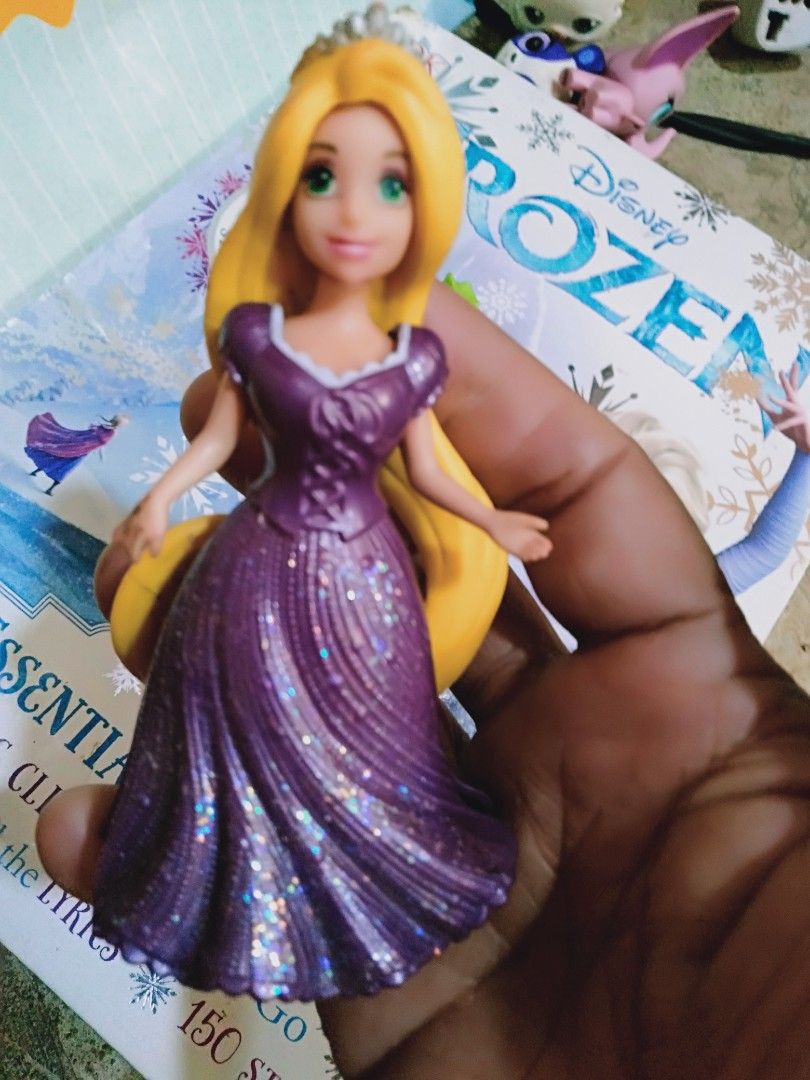 Disney Tangled Rapunzel & Pascal Figurines (Category: Figurines & Statues) located in Davao. Submitted by bravemoon_556cd5 (Listing ID 1445247991, Image 2). Description: - Cute Rapunzel and Pascal figures from Disney's Tangled. - Rapunzel wears her iconic purple dress. - Pascal is bright green. - Ideal for Disney fans and collectors. - Small size, suitable for display or play..