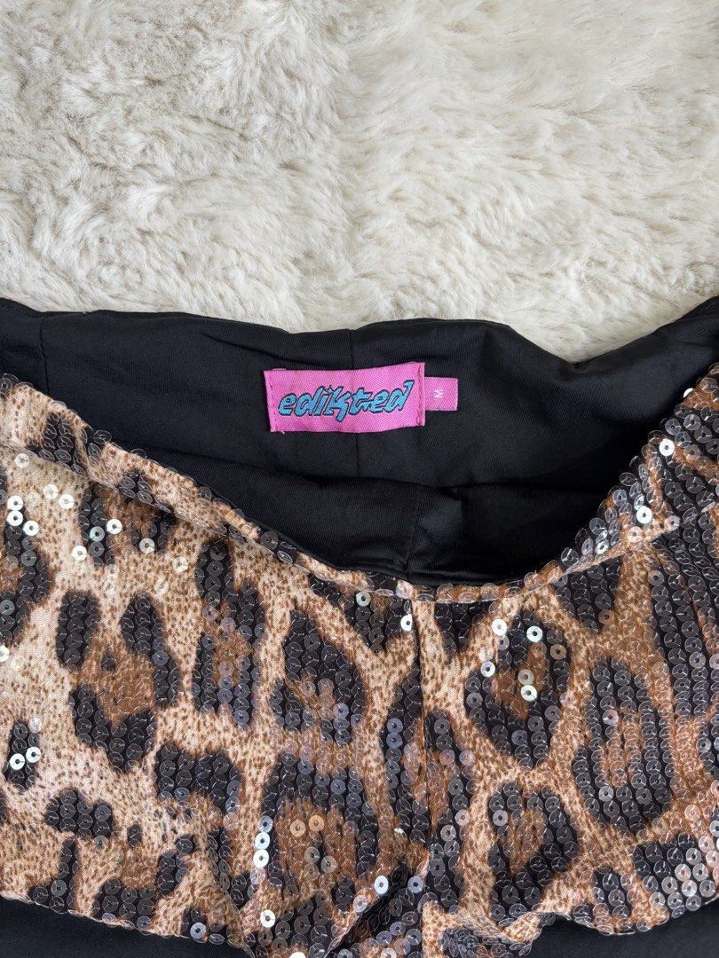 Edikted Leopard Sequin Micro Shorts (Category: Shorts) located in Davao. Submitted by kirennnnn (Listing ID 1445312516, Image 2). Description: - Eye-catching sparkly leopard print shorts - Fully covered in sequins - Comfortable black lining inside - Ideal for parties, festivals, or making a statement - Size: Medium (M).