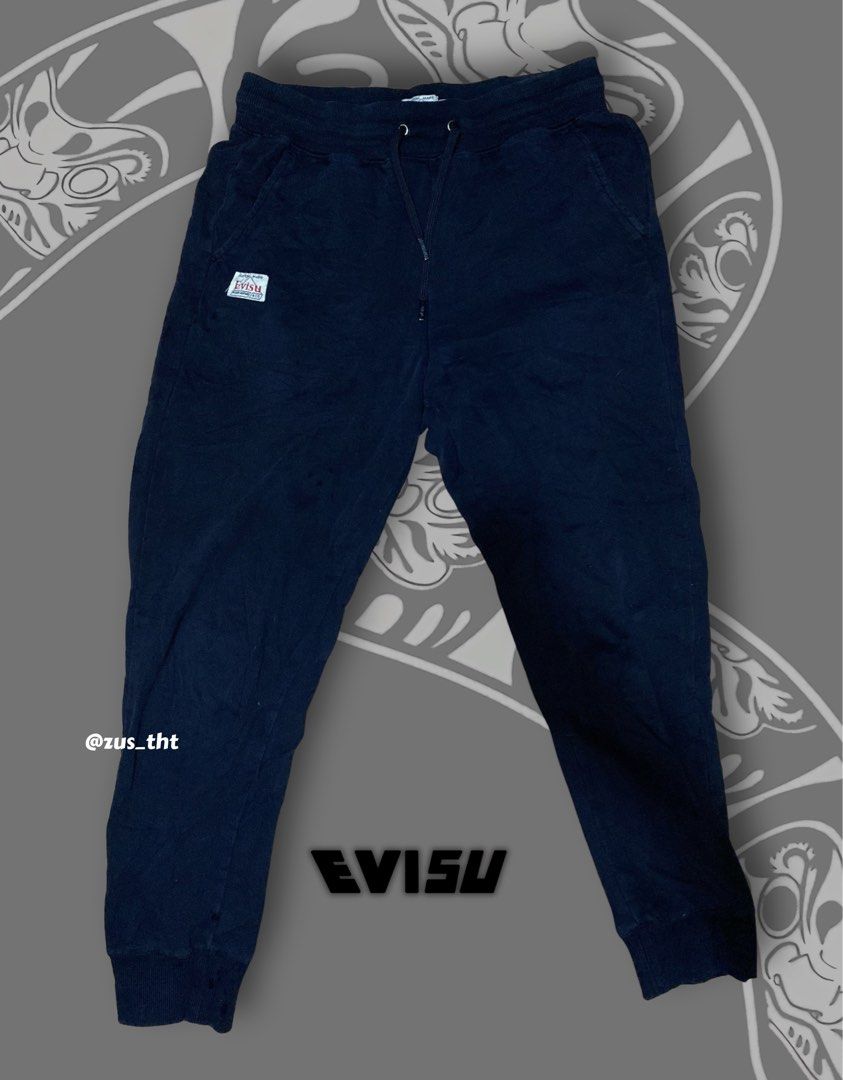 EVISU Custom Made Sweatpants (Category: Joggers) located in Makati City. Submitted by zus_tht (Listing ID 1445400773, Image 2). Description: - Complete Tags - Color: Black - Features: Iconic Evisu logo graphic on legs, drawstring waist for comfortable fit - Style: Great for casual wear - Size: Small (S) on Tag - Condition: Please check photos for detailed condition. Need wash.