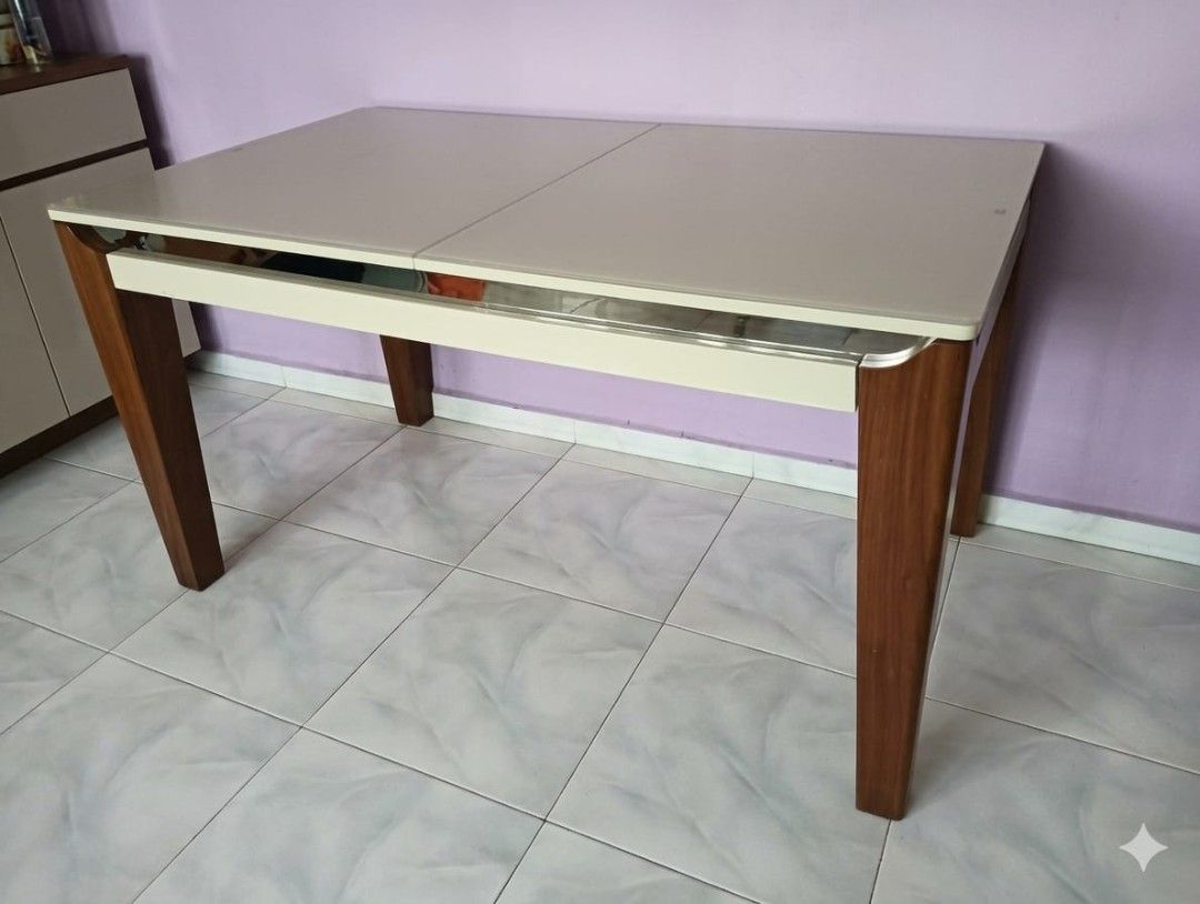 Extendable Dining Table (Category: Tables & Sets) located in Singapore. Submitted by easycomeeasyg0 (Listing ID 1445419838, Image 1). Description: Rectangular Extendable Dining Table – Tempered Glass Top Self collection + own movers arrangement 📏 Dimensions: Height: 750mm Width: 800mm Length: 1400mm → extends to 1685mm ✨ Condition & Features: - *Tabletop:Light-colored extendable + tempered glass surface. Easy to clean, scratch-resistant - Legs: 