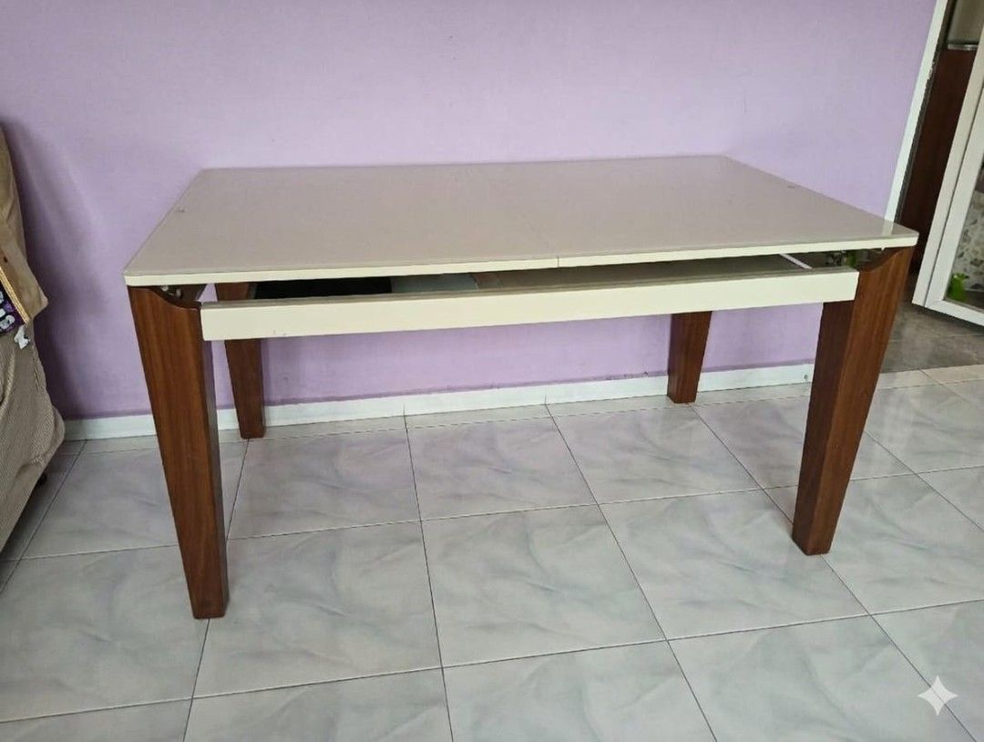 Extendable Dining Table (Category: Tables & Sets) located in Singapore. Submitted by easycomeeasyg0 (Listing ID 1445419838, Image 2). Description: Rectangular Extendable Dining Table – Tempered Glass Top Self collection + own movers arrangement 📏 Dimensions: Height: 750mm Width: 800mm Length: 1400mm → extends to 1685mm ✨ Condition & Features: - *Tabletop:Light-colored extendable + tempered glass surface. Easy to clean, scratch-resistant - Legs: 