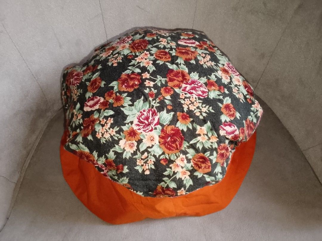 Floral Bucket Hat with Orange Brim (Category: Hats & Beanies) located in Binangonan. Submitted by yuristalin888 (Listing ID 1445245215, Image 2). Description: - Cute bucket hat with a dark floral print. - Features a vibrant bright orange brim. - Ideal for sunny days and outdoor activities. - Adds a stylish pop of color to any outfit. - Lightweight and easy to pack for travel..