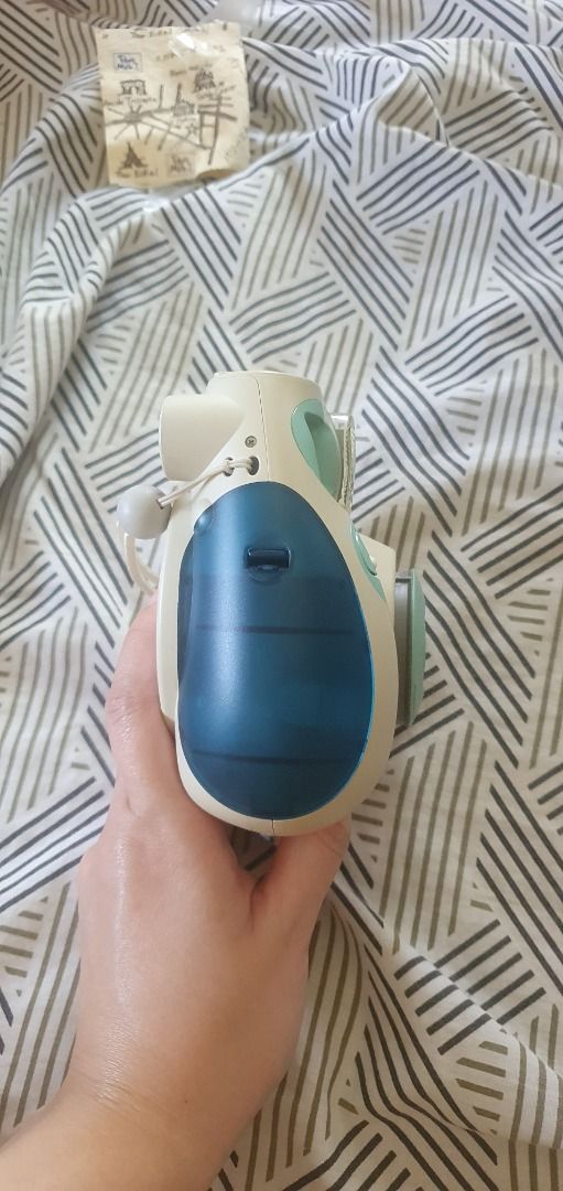 Fujifilm Instax Mini 7 Camera DEFECTIVE (Category: Cameras) located in Muntinlupa City. Submitted by kathenan (Listing ID 1445284866, Image 3). Description: - Fujifilm Instax Mini 7 camera - TESTED & NOT WORKING - Color: Cream and Blue - Few Cosmetic Scratches and Scuffs - Battery contacts look dirty (see final two pics for details), I tried to clean them but it still didn't turn on or light up - Only for display, repair, or parts.