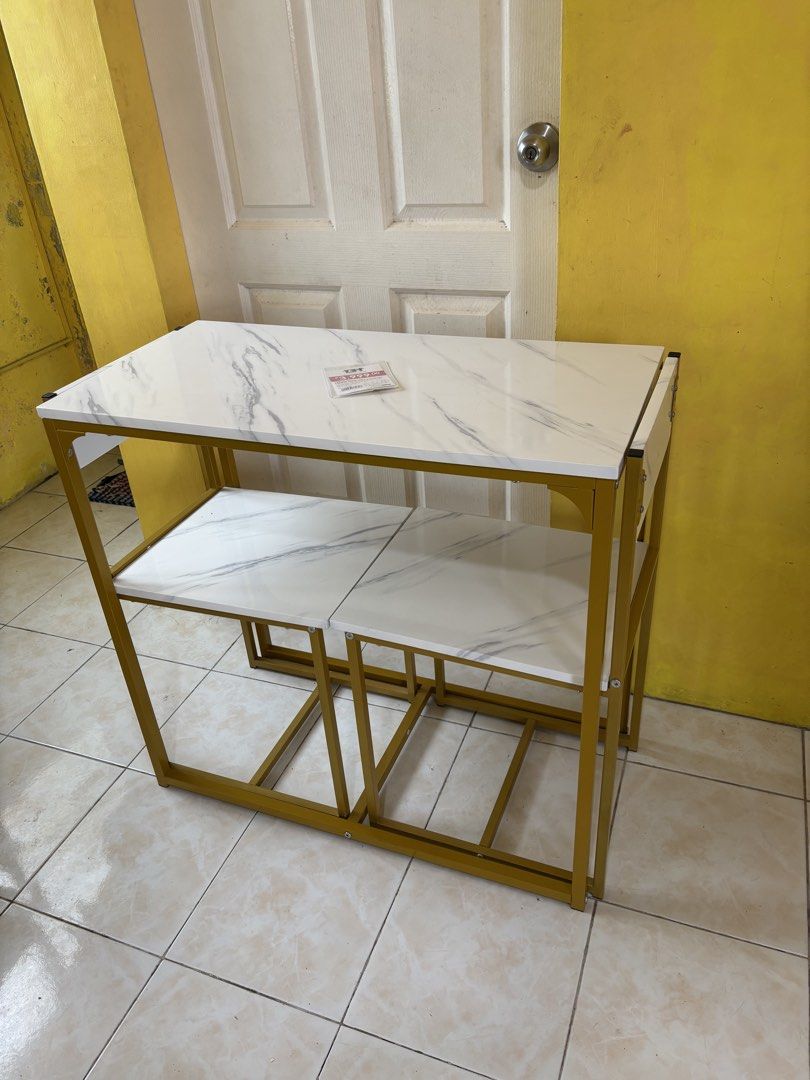 Grand Home 2-Seater Dining Table & Chair Set (Category: Tables & Sets) located in Roxas City. Submitted by jhen_c (Listing ID 1445240939, Image 3). Description: Stylish 2-seater dining set! White marble-look top, gold frame. Perfect for small spaces. Chairs tuck under. P2,800 .