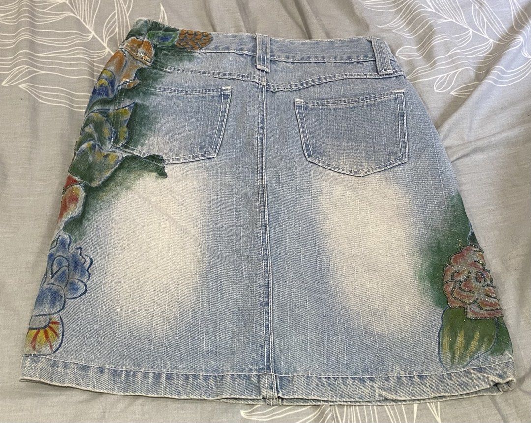 hand-painted and beaded denim skirt (Category: Skirts) located in Rizal. Submitted by onfourthz (Listing ID 1445319719, Image 2). Description: - fits a medium - price is negotiable if sure buyer! - never been worn by me, but it’s secondhand from a pop up - rfs: it was gifted to me by a friend, but it wasn’t my size - buyer will shoulder the sf.