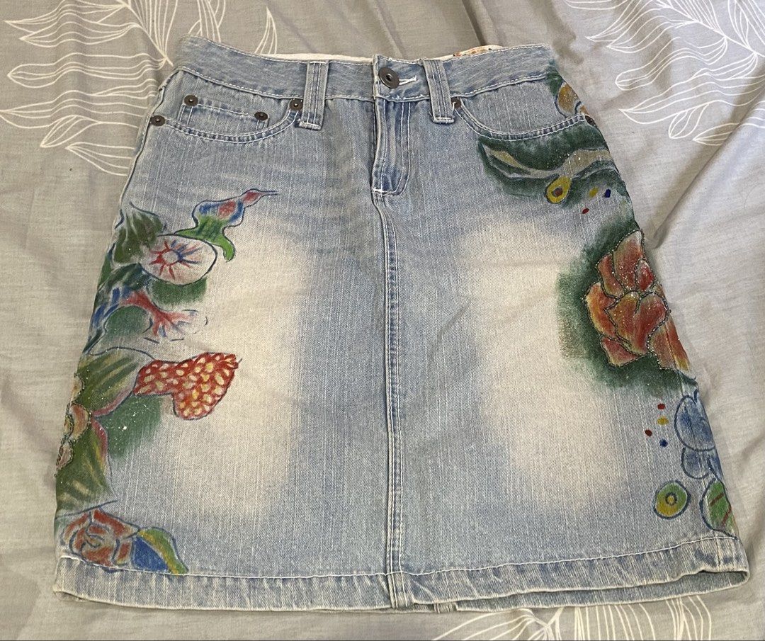 hand-painted and beaded denim skirt (Category: Skirts) located in Rizal. Submitted by onfourthz (Listing ID 1445319719, Image 1). Description: - fits a medium - price is negotiable if sure buyer! - never been worn by me, but it’s secondhand from a pop up - rfs: it was gifted to me by a friend, but it wasn’t my size - buyer will shoulder the sf.