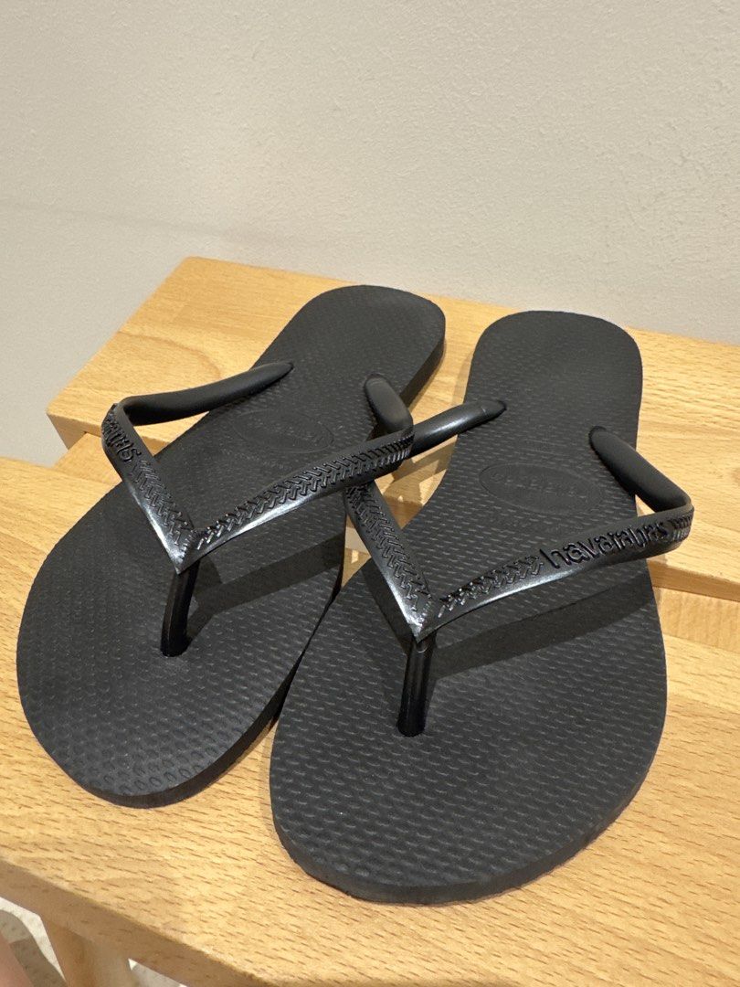 Havaianas Black Flip Flops size 35/36 Black (Category: Flipflops and Slides) located in Singapore. Submitted by wearecommons (Listing ID 1445391379, Image 3). Description: - Classic black Havaianas flip-flops - Dark grey (almost black) straps - Comfortable for everyday wear - Signature textured grip soles - Ideal for beach or casual outings - Easy slip-on and off - Wardrobe staple - Size 35/36.