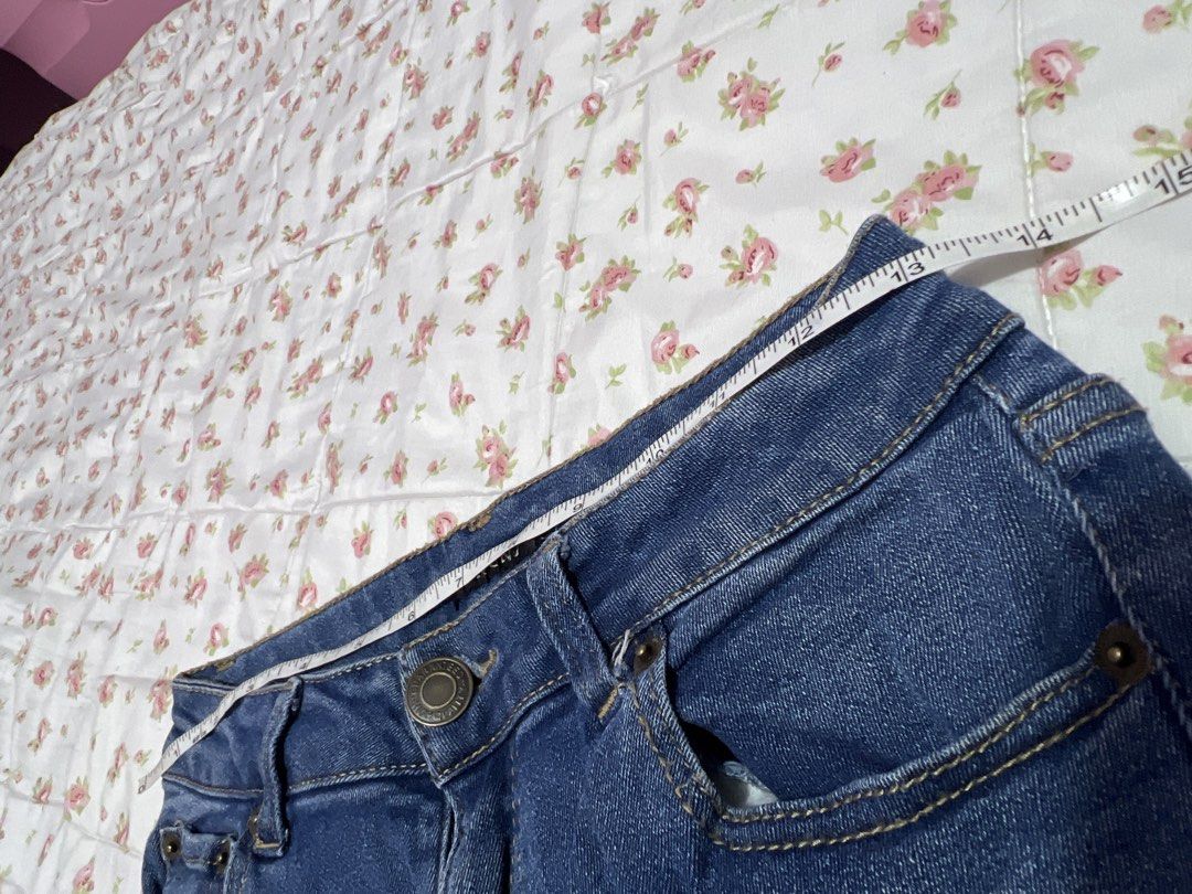INGNI Blue Distressed Ripped Denim Jeans (Category: Jeans) located in Pasig City. Submitted by morilove (Listing ID 1445245974, Image 2). Description: - Brand: INCINI - Style: Blue denim jeans - Features: Distressed rips on front, frayed hem detail - Measurements: Waist approx. 13 inches across, Inseam approx. 30 inches - Occasion: Great for casual wear.