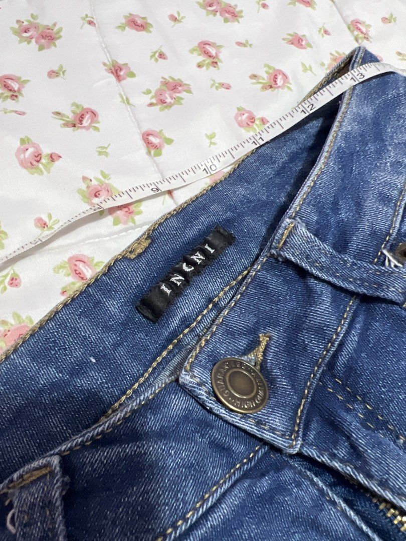 INGNI Blue Distressed Ripped Denim Jeans (Category: Jeans) located in Pasig City. Submitted by morilove (Listing ID 1445245974, Image 3). Description: - Brand: INCINI - Style: Blue denim jeans - Features: Distressed rips on front, frayed hem detail - Measurements: Waist approx. 13 inches across, Inseam approx. 30 inches - Occasion: Great for casual wear.