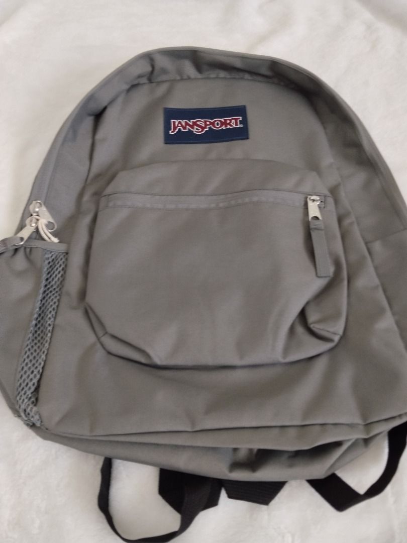 Jansport Grey Backpack (Category: Backpacks) located in Manila. Submitted by cooltiger.7917b8 (Listing ID 1445249162, Image 1). Description: - Classic grey Jansport backpack - Main compartment for storage - Front zipper pocket for essentials - Side mesh pocket for water bottle - Adjustable straps for comfort - Ideal for school or everyday use.