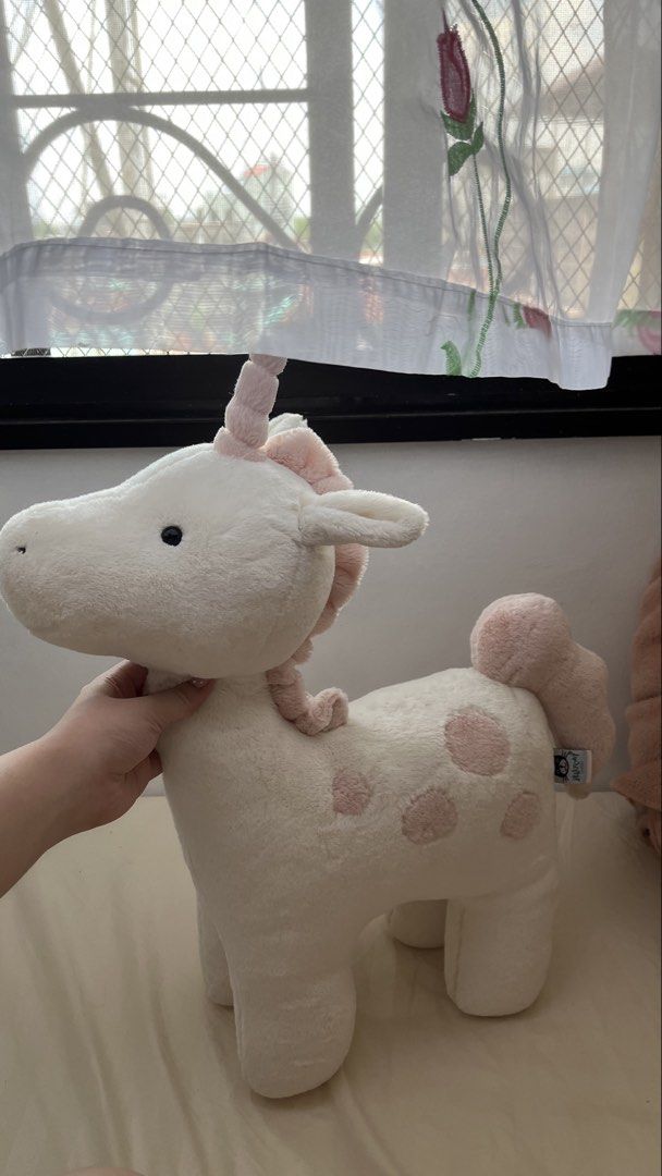 Jellycat large Unicorn Plush Toy (Category: Plushies & Soft Toys) located in Quezon City. Submitted by jellycooties (Listing ID 1445271379, Image 1). Description: - Adorable Jellycat Bartholomew Bear Unicorn plush - Super soft and cuddly material - White with charming pink spots - Features a lovely pink mane and tail - Approximately 12 inches tall - Ideal for nursery decor or as a special gift.