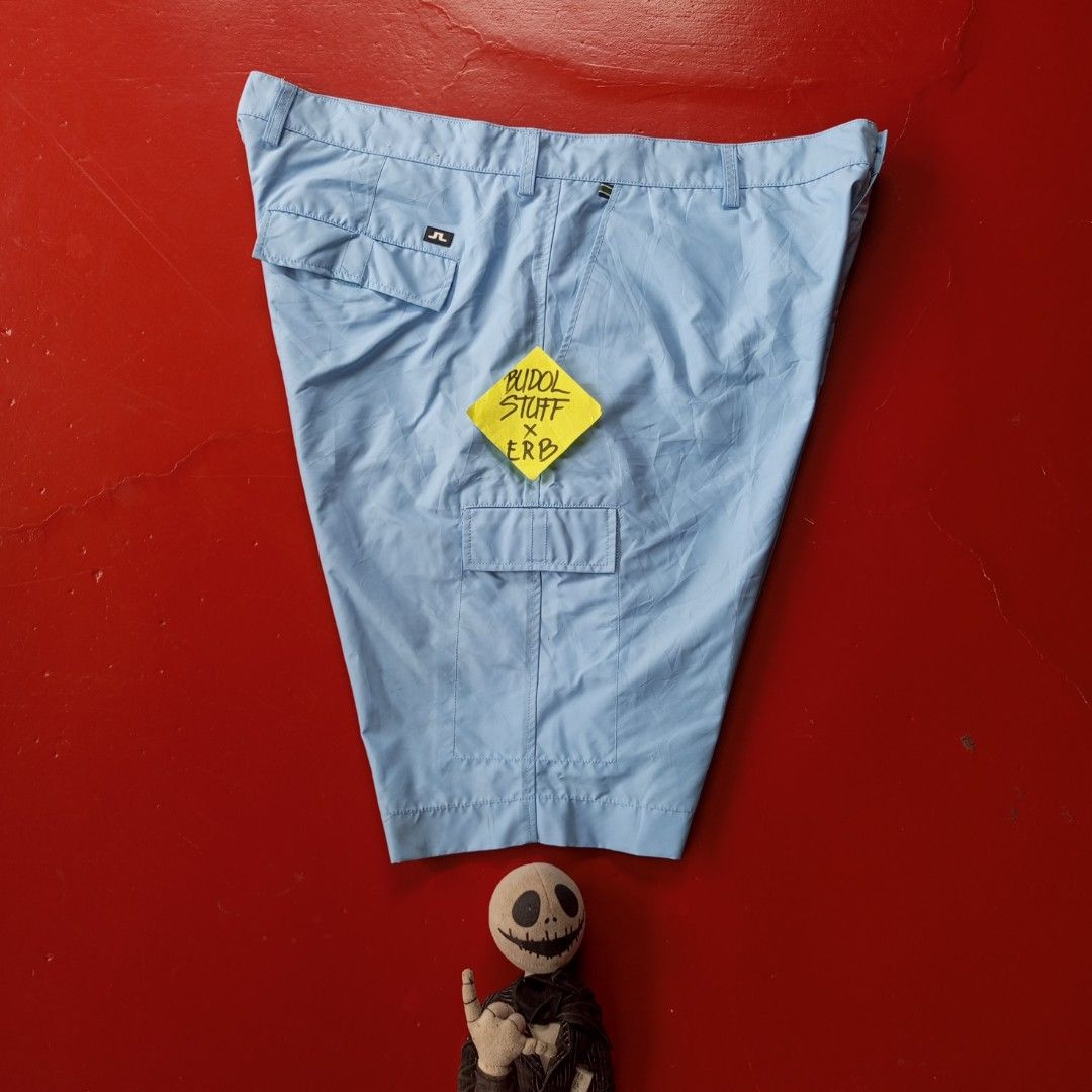 j.lindeberg Light Blue Cargo Golf Shorts (Category: Shorts) located in Naga. Submitted by ErbsXBudolstuff (Listing ID 1445382610, Image 1). Description: - Light blue J.Lindeberg cargo shorts Regular fit - Features pockets on front, back, and sides - Secure button and zip closure - Ideal for golf or casual wear Size 38 36to 40 fit Length 22 inc 6 Pockets Button Zipper Working.