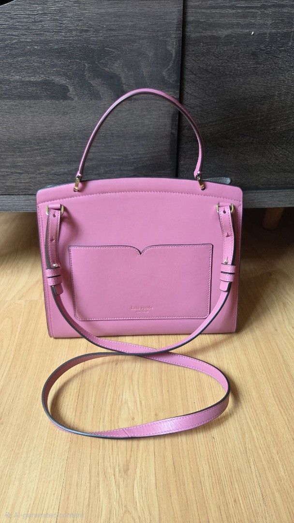 Kate Spade Romy Satchel Medium (Category: Luxury Bags & Wallets) located in Manila. Submitted by osssoliman (Listing ID 1445275330, Image 2). Description: - Genuine Kate Spade Romy Satchel medium - Crafted from durable pebbled leather - Versatile with a top handle and detachable shoulder strap - Iconic Kate Spade twistlock on the front - Convenient back slip pocket for quick access - Protective metal feet on the bottom - Includes dust bag.