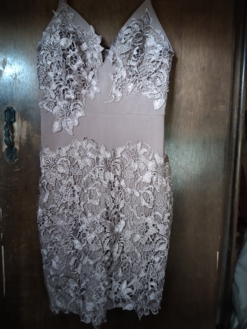 Lace Overlay Mini Dress with Spaghetti Straps (Category: Dresses) located in Manila. Submitted by fiercefish.b07a25 (Listing ID 1445345469, Image 2). Description: - Nude-toned mini dress - Intricate white lace overlay - V-neckline with adjustable spaghetti straps - Detailed lace on bust and hem - Back zipper closure - Bodycon fit, short length - Ideal for parties and events MEASUREMENTS: BUST 32 TO 34 INCHES WAIST 26 TO 28 INCHES LENGTH 33 INCHES