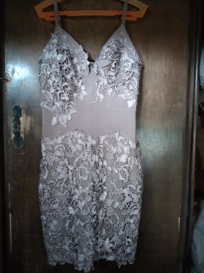 Lace Overlay Mini Dress with Spaghetti Straps (Category: Dresses) located in Manila. Submitted by fiercefish.b07a25 (Listing ID 1445345469, Image 1). Description: - Nude-toned mini dress - Intricate white lace overlay - V-neckline with adjustable spaghetti straps - Detailed lace on bust and hem - Back zipper closure - Bodycon fit, short length - Ideal for parties and events MEASUREMENTS: BUST 32 TO 34 INCHES WAIST 26 TO 28 INCHES LENGTH 33 INCHES