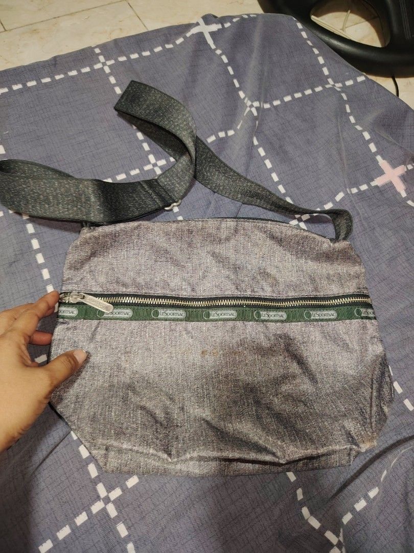 LeSportsac Grey Crossbody Bag (Category: Cross-body Bags) located in Cainta. Submitted by badet0521 (Listing ID 1445367524, Image 2). Description: - Grey LeSportsac crossbody bag - Main compartment with internal pockets - Front zip pocket for easy access - Adjustable strap for comfortable wear - Ideal for everyday use - Clean interior and exterior.