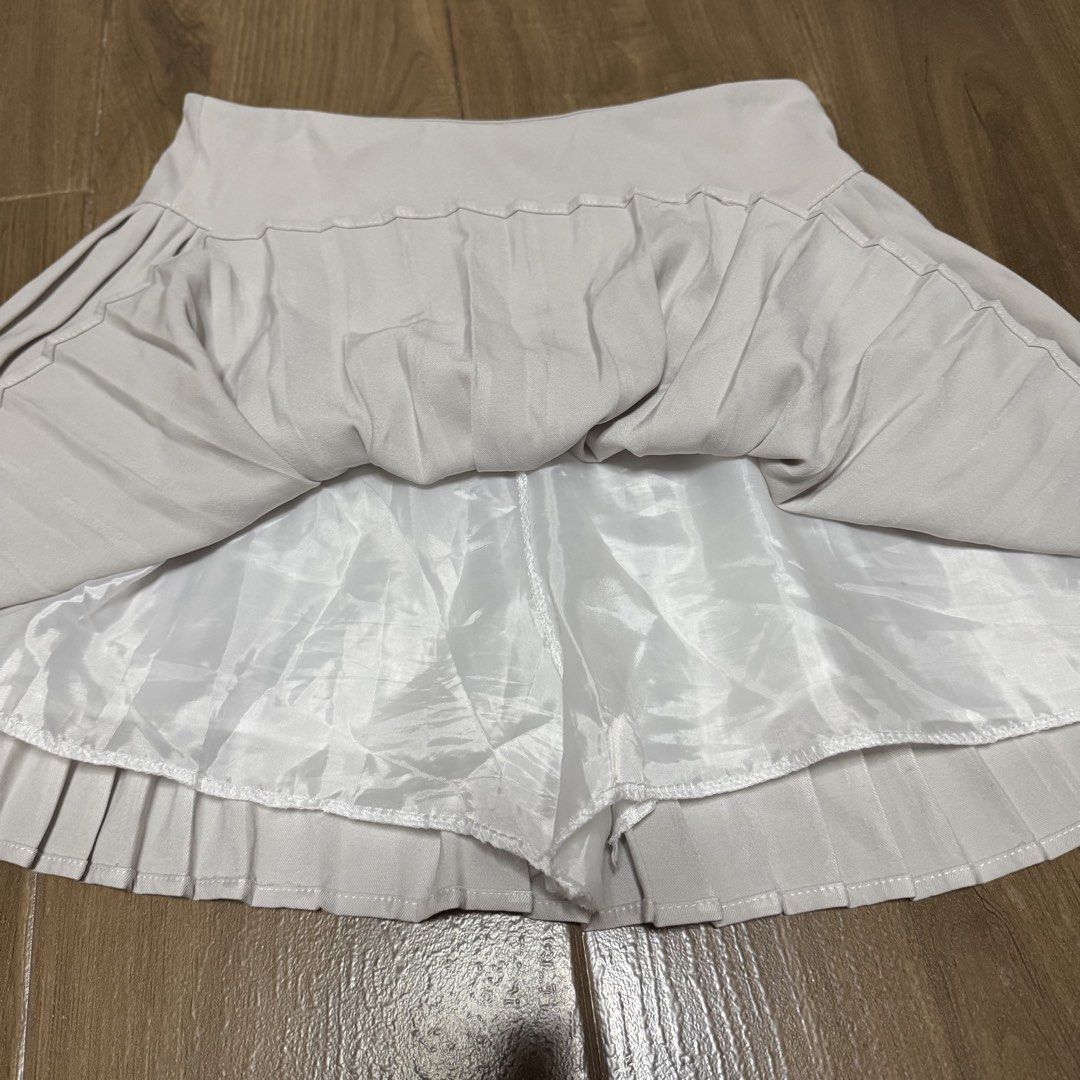 Light Gray Pleated Skirt with Shorts (Category: Skirts) located in Quezon City. Submitted by elysianpieces.ph (Listing ID 1445398081, Image 3). Description: ~ Light gray pleated skirt ~ Zipper on the side ~ Has safety shorts ~ Dimensions Waistline: Approx. 29in Length: Approx. 15in ~ Size L ~ Comes with freebies Kindly DM if interested or if you have any questions! MOP: GCash / PayMaya / BDO MOD: SDD / J&T / Gogo Express .