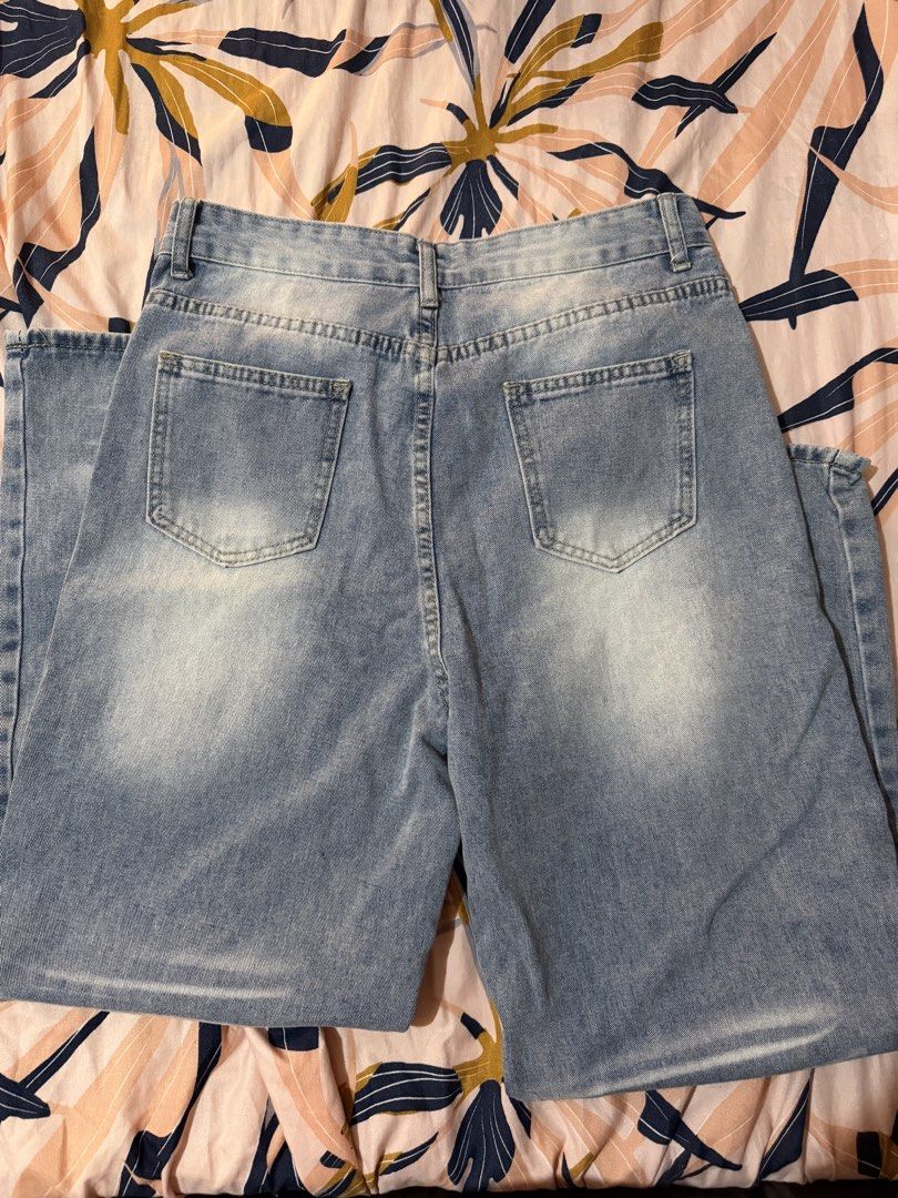 Light Wash Denim Jeans - High Waisted (Category: Jeans) located in Taytay. Submitted by cloudy_20 (Listing ID 1445371386, Image 2). Description: - Light wash denim jeans - High-waisted style - Distressed details on front and back - Button and zip closure - Two front pockets, two back pockets - Measurements available in photos - Perfect staple piece for any wardrobe - Size 32.