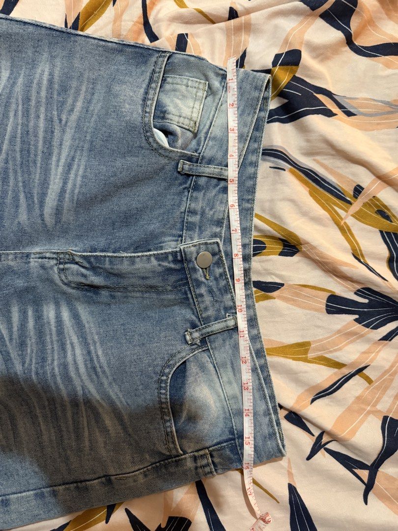 Light Wash Denim Jeans - High Waisted (Category: Jeans) located in Taytay. Submitted by cloudy_20 (Listing ID 1445371386, Image 3). Description: - Light wash denim jeans - High-waisted style - Distressed details on front and back - Button and zip closure - Two front pockets, two back pockets - Measurements available in photos - Perfect staple piece for any wardrobe - Size 32.