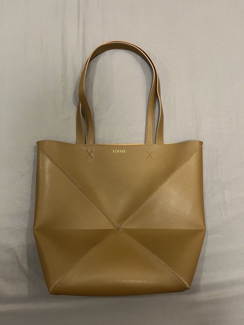 Loewe Medium Puzzle Fold Tote Bag Brown (Category: Luxury Bags & Wallets) located in Manila. Submitted by champa6nepapiii (Listing ID 1445382305, Image 1). Description: - no hidden flaws, perfect condition (10/10) - 4,500 + sf (nego) - can fit 13” laptop.