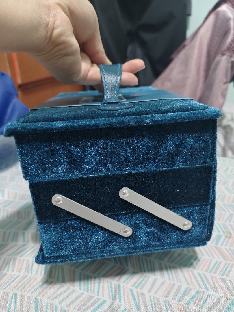 Macy's The Ultimate Travel Makeup Case (Category: Makeup) located in Antipolo. Submitted by littlebeybiboo (Listing ID 1445354509, Image 3). Description: - Teal velvet makeup case from Macy's, named 'The Ultimate Travel Makeup Case'. - Features 20 shimmer eyeshadows and 15 matte eyeshadows. - Includes 2 blushes and 2 highlighters. - Also contains 1 face powder, 1 contour powder, 1 lip gloss, 1 eyeliner, and 1 lip liner. - Total net weight: 0.93 o