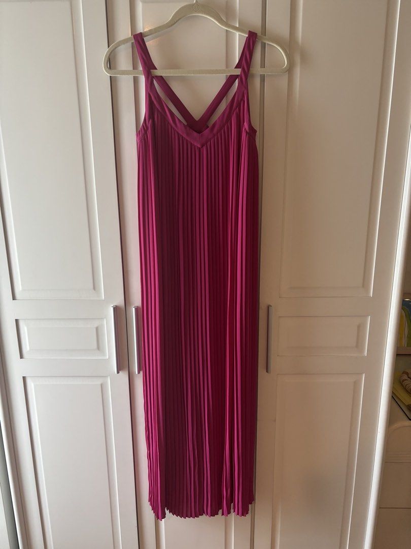 Massimo Dutti Pink Pleated Maxi Dress (Category: Dresses) located in Makati City. Submitted by geministyle (Listing ID 1445279430, Image 1). Description: - Brand: Massimo Dutti - Size: US 4 - Color: Pink - Design: All-over pleats - Back detail: Criss-cross straps - Length: Midi - Condition: Only worn a few times. In very good condition. - Original price: P5000+.