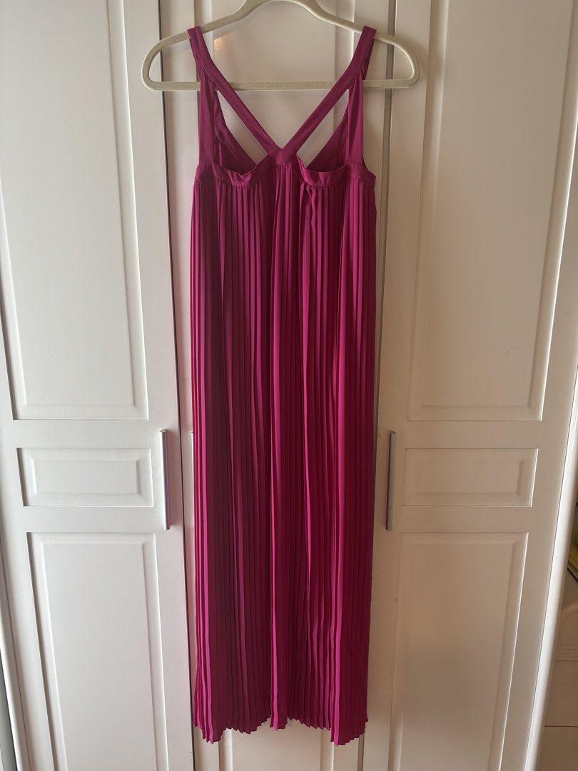Massimo Dutti Pink Pleated Maxi Dress (Category: Dresses) located in Makati City. Submitted by geministyle (Listing ID 1445279430, Image 2). Description: - Brand: Massimo Dutti - Size: US 4 - Color: Pink - Design: All-over pleats - Back detail: Criss-cross straps - Length: Midi - Condition: Only worn a few times. In very good condition. - Original price: P5000+.