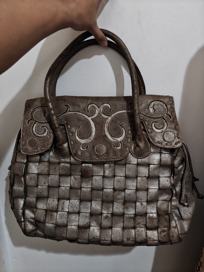 Metallic Woven Handbag with Decorative Top (Category: Tote Bags) located in Pasay City. Submitted by ryuthrifty (Listing ID 1445251905, Image 1). Description: - Cool metallic woven handbag - Unique textured design - Flap closure with button - Interior zippered pocket - Interior slip pocket - Sturdy handles - Great for adding flair to outfits.