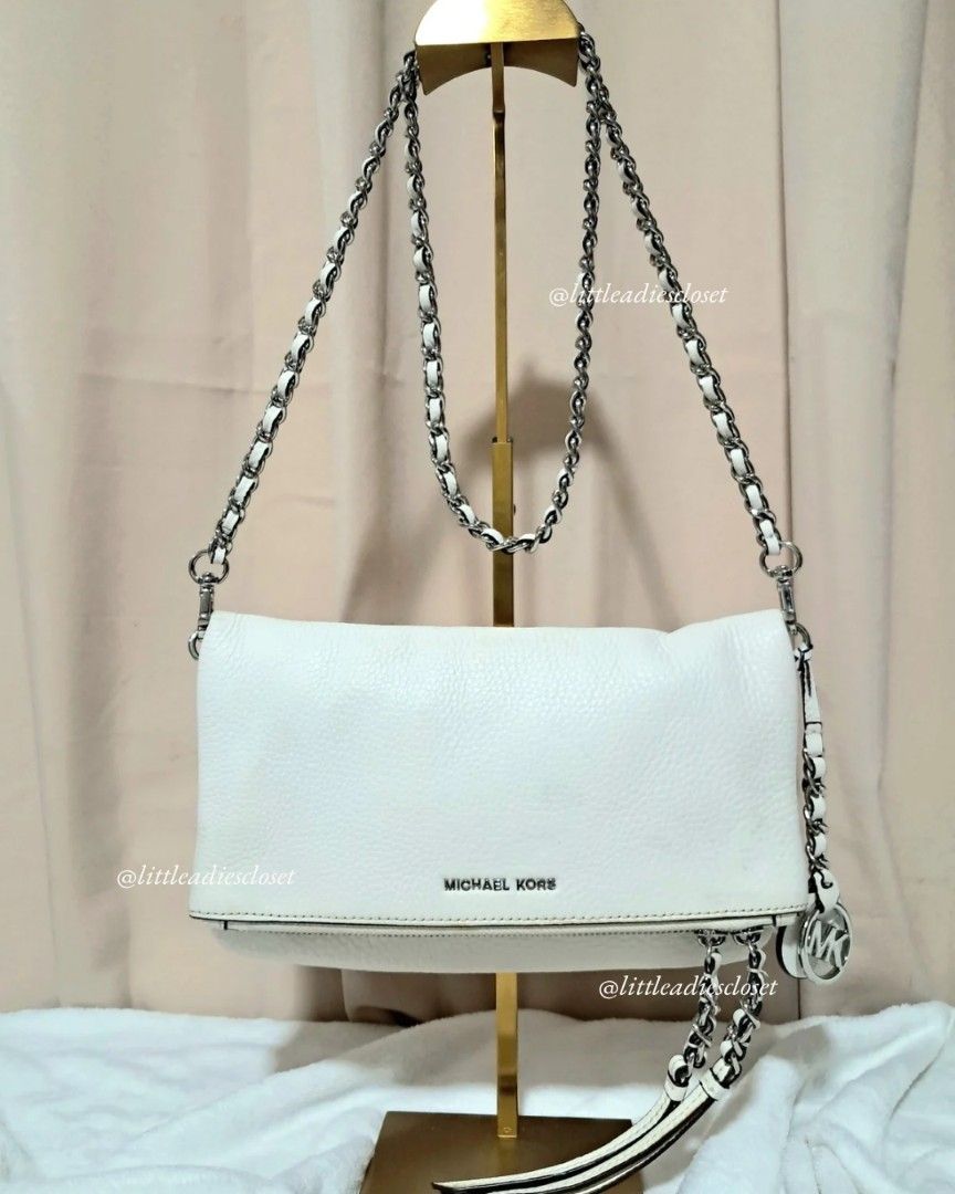 Michael Kors | Corrine White Leather Chain Shoulder Bag (Category: Luxury Bags & Wallets) located in Taguig. Submitted by call.me.eni (Listing ID 1445366160, Image 1). Description: Condition: Very Good Preloved Condition ✔ Clean interior and exterior ✔ Leather remains soft and structured ✔ Hardware is shiny and in excellent condition ✔ Minimal signs of use overall ✔ Very minor color transfer on the leather (barely noticeable during actual use) ✔ 