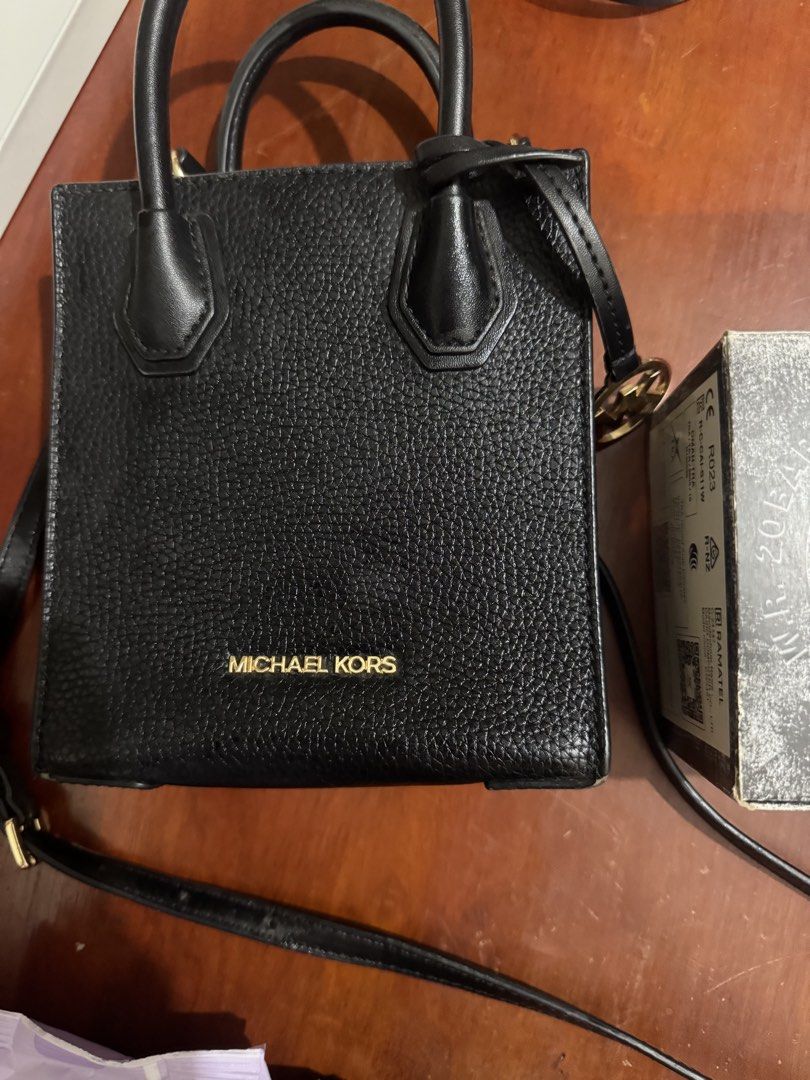 Michael Kors Black Leather Handbag – Authentic, Elegant, Premium Condition (Category: Waste Bins & Bags) located in Quezon City. Submitted by dkpestcontrolservices (Listing ID 1445358543, Image 3). Description: Description: For sale: Authentic Michael Kors black leather handbag with gold MK hardware. • Textured pebbled leather, durable and stylish • Comes with dual handles and adjustable shoulder strap for versatile use • Spacious interior with c