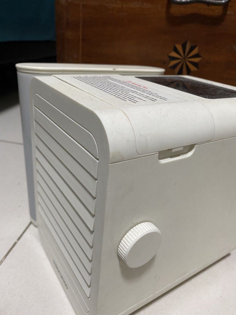Microhoo Portable Air Cooler with Water Tank (Category: Air Conditioning and Heating) located in Quezon City. Submitted by waytodeclutter (Listing ID 1445370261, Image 2). Description: - Portable air cooler from Microhoo - Features a detachable water tank - Adjustable vents for customized airflow - Easy-to-use control knob - Convenient USB power port - Ideal for personal cooling solutions - In good working condition.