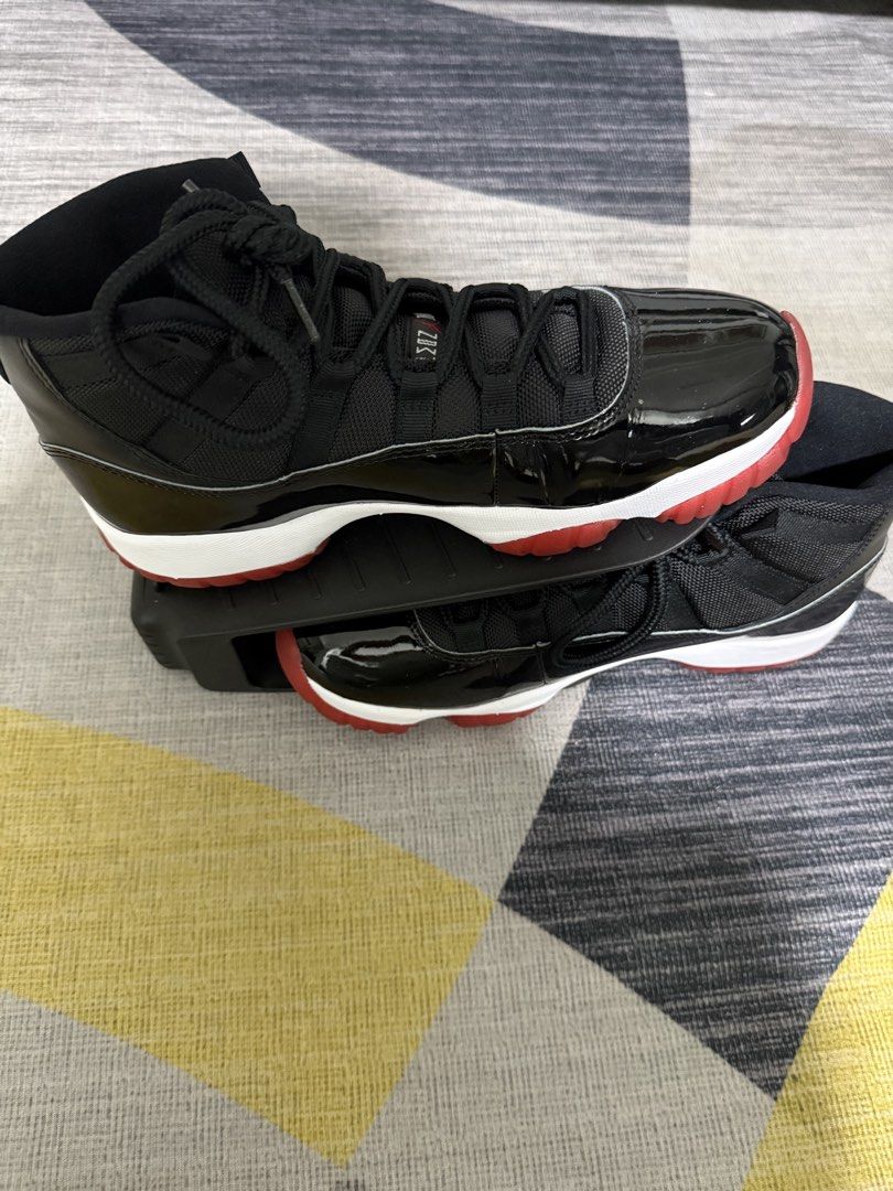 Nike Air Jordan 11 Retro "Bred" (Category: Sneakers) located in Taguig. Submitted by jocher74605 (Listing ID 1445249905, Image 2). Description: I collect shoes. Worn only once. No box - Classic Bred 11s - Black patent leather and mesh upper - Red outsole and Jumpman logo - Iconic silhouette - Perfect for collectors or everyday wear - Essential for any sneakerhead.