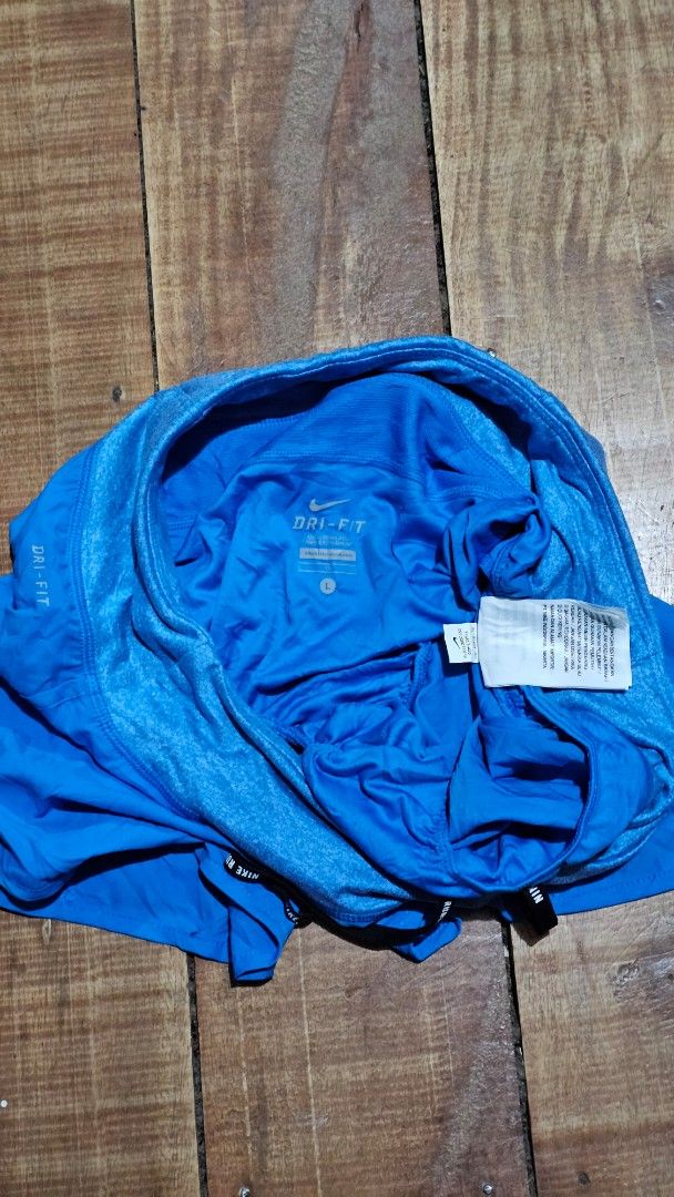 Nike Dri-FIT Blue Running Shorts (Category: Activewear) located in Kibawe. Submitted by Thrift_ni_Babac (Listing ID 1445241142, Image 2). Description: - Blue Nike running shorts - Made with Dri-FIT material for sweat-wicking - Elastic waistband with adjustable drawstring - Features the iconic Nike logo on the leg - Perfect for running, workouts, or any athletic activity - Lightweight and comfortable for maximum performance.