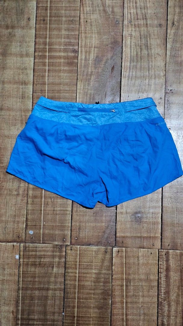 Nike Dri-FIT Blue Running Shorts (Category: Activewear) located in Kibawe. Submitted by Thrift_ni_Babac (Listing ID 1445241142, Image 3). Description: - Blue Nike running shorts - Made with Dri-FIT material for sweat-wicking - Elastic waistband with adjustable drawstring - Features the iconic Nike logo on the leg - Perfect for running, workouts, or any athletic activity - Lightweight and comfortable for maximum performance.