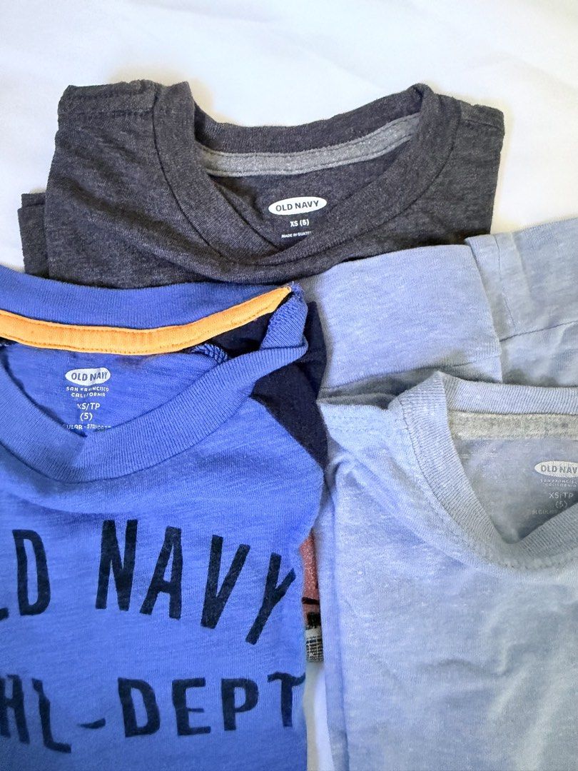 Old Navy Boys' T-shirts Bundle (Size XS/TP) (Category: Babies & Kids Fashion) located in Marilao. Submitted by mebslerman (Listing ID 1445411205, Image 2). Description: - Bundle of 3 Old Navy t-shirts for boys. - Sizes: XS or TP (Extra Small / Teen Petite). - Includes: - Blue raglan tee with 'Old Navy Athl-Dept Est. 94' graphic. - Dark grey tee with city skyline and basketball graphic. - Light blue pocket tee. - Condition: Minor marks noted on th