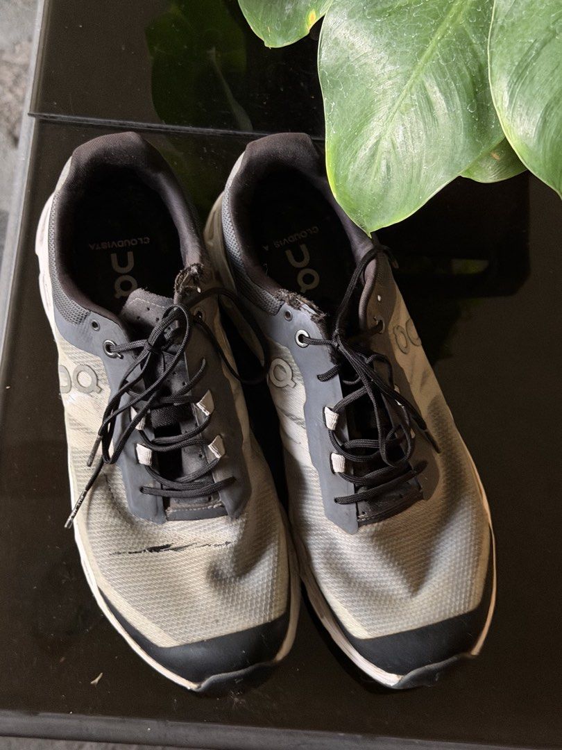ON Cloudvista Running Shoes Grey Black (Category: Sneakers) located in Angeles City. Submitted by endzn (Listing ID 1445328858, Image 3). Description: - ON Cloudvista running shoes - Color: Grey and black with white soles and grey accents - Condition: Some scuffing on toe boxes and sides, laces are intact - Ideal for: Trail running or everyday wear.