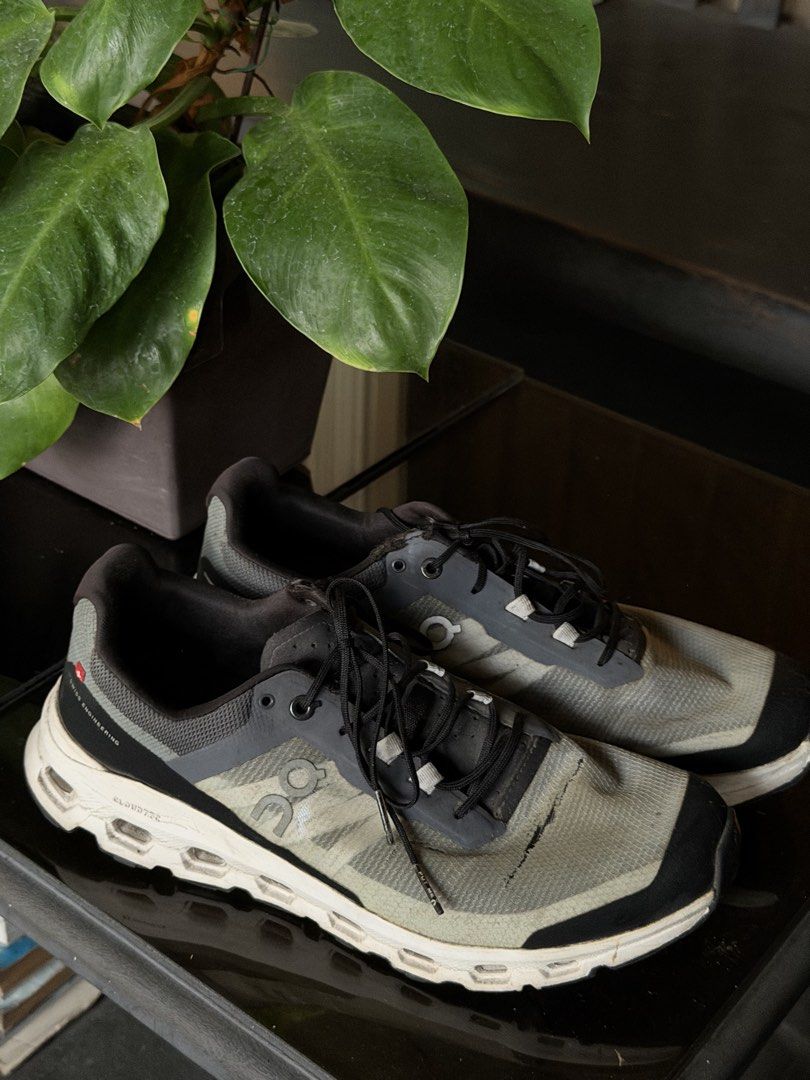 ON Cloudvista Running Shoes Grey Black (Category: Sneakers) located in Angeles City. Submitted by endzn (Listing ID 1445328858, Image 2). Description: - ON Cloudvista running shoes - Color: Grey and black with white soles and grey accents - Condition: Some scuffing on toe boxes and sides, laces are intact - Ideal for: Trail running or everyday wear.