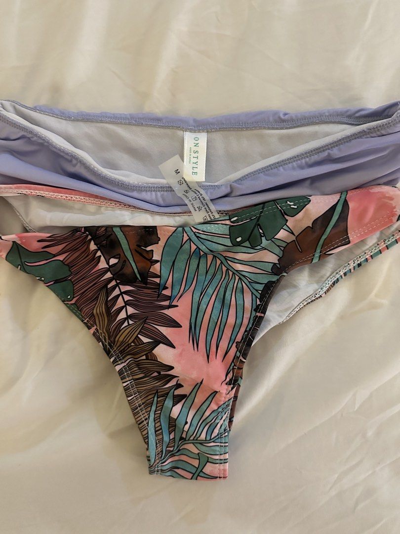 ONSTYLE Bikini Bottoms - Lavender & Tropical Print (Category: Bikinis & Swimsuits) located in Quezon City. Submitted by talamnl (Listing ID 1445397352, Image 3). Description: - Two bikini bottoms, size Medium. - One lavender with ruched waistband. - One vibrant tropical print with palm leaves and pink accents. - washed but never used .