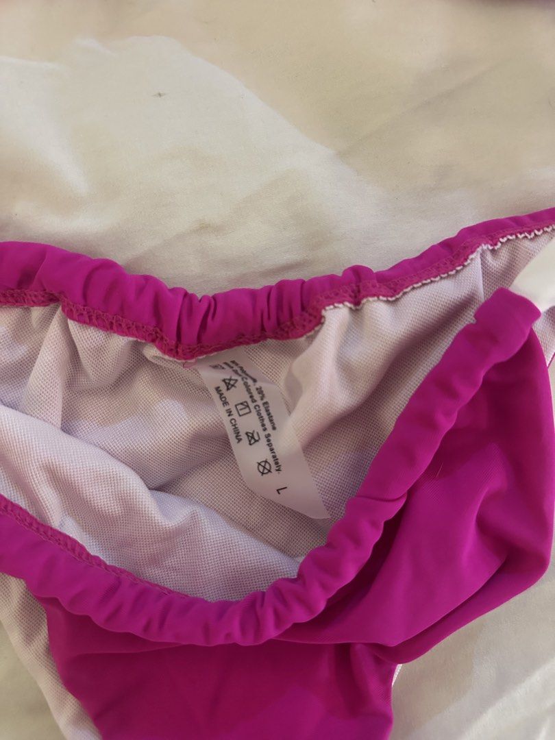 Pink and White Bandeau Bikini Set (Category: Bikinis & Swimsuits) located in Quezon City. Submitted by talamnl (Listing ID 1445398517, Image 2). Description: - Cute pink bikini - Size L - Bandeau top with front tie detail - Bottoms with white trim and ruched waistband Never used.