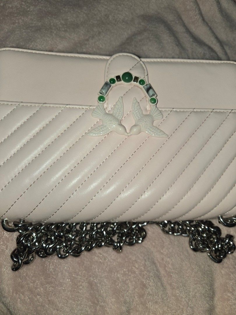 PINKO pink Chevron Quilted Shoulder Bag with Bird Clasp (Category: Luxury Bags & Wallets) located in Tarlac. Submitted by jelly_thrift (Listing ID 1445387724, Image 2). Description: MINIMAL FLAWS, SUPER MINIMAL RUBS. 10/10 PA SA APPEARANCE. PWEDE TUMAWAD. GOODS PA HARDWARE Adorable pink shoulder bag - Stylish chevron quilting on the front flap - Unique bird clasp with green stone accents - Chic silver chain strap - Interior includes a zippered po