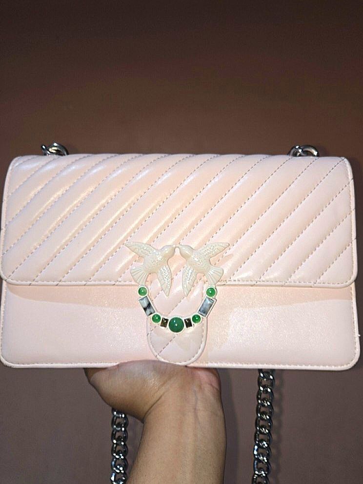 PINKO pink Chevron Quilted Shoulder Bag with Bird Clasp (Category: Luxury Bags & Wallets) located in Tarlac. Submitted by jelly_thrift (Listing ID 1445387724, Image 1). Description: MINIMAL FLAWS, SUPER MINIMAL RUBS. 10/10 PA SA APPEARANCE. PWEDE TUMAWAD. GOODS PA HARDWARE Adorable pink shoulder bag - Stylish chevron quilting on the front flap - Unique bird clasp with green stone accents - Chic silver chain strap - Interior includes a zippered po