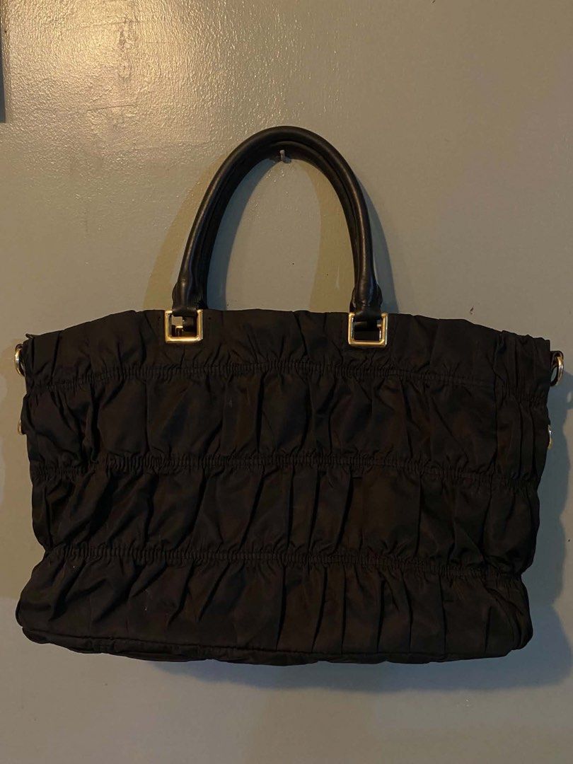 Prada Gaufre Tote Tessuto Nylon (Category: Luxury Bags & Wallets) located in Cagayan de Oro. Submitted by timeless.ph (Listing ID 1445340798, Image 3). Description: Material: Tesutto Nylon Features: Distinct gathered texture, a taised gold-tone prada metal logo Condition: Rank AB Issue: Missing sling & removed main puller (still working and has the removed puller kept).