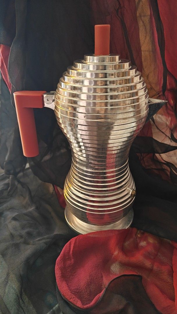 Alessi Pulcina Espresso coffee maker. Induction. (Category: Coffee Machines & Makers) located in Caloocan City. Submitted by finds_forkeeps (Listing ID 1445256722, Image 1). Description: alessi induction coffee maker Width (cm) 12.00 Height (cm) 26.00 Length (cm) 20.00 Capacity (cl) 30.00 Cups 6 A revolutionary moka that combines the technology developed by illycaffè and the design experience of Alessi. Designed by Michele de Lucchi, Pulcina enca