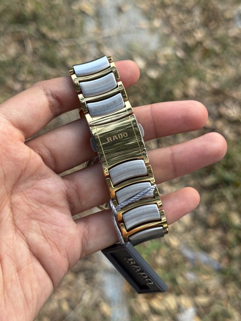 RADO Centrix White Dial Men’s Watch (Category: Luxury Watches) located in Bulacan. Submitted by baywatchesph (Listing ID 1445335403, Image 3). Description: RADO Centrix White Dial Men’s Watch Ref no. R30953123 Automatic movement 38mm case diameter (Men’s size) 80 hours power reserve Sapphire crystal Date display at the 3 o’clock position Water resistance 3 bar (30m) Open-Heart back case Swiss made With box, card, and extra links. 9/10 - Pre-loved