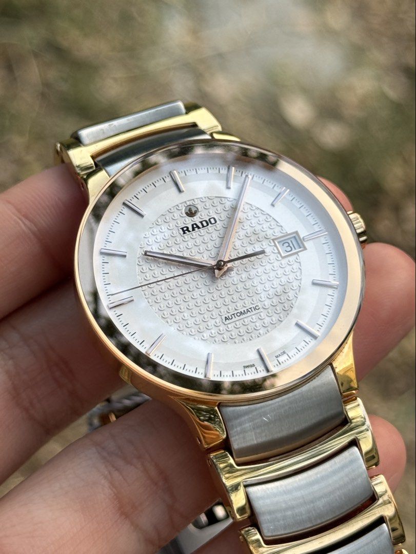 RADO Centrix White Dial Men’s Watch (Category: Luxury Watches) located in Bulacan. Submitted by baywatchesph (Listing ID 1445335403, Image 2). Description: RADO Centrix White Dial Men’s Watch Ref no. R30953123 Automatic movement 38mm case diameter (Men’s size) 80 hours power reserve Sapphire crystal Date display at the 3 o’clock position Water resistance 3 bar (30m) Open-Heart back case Swiss made With box, card, and extra links. 9/10 - Pre-loved