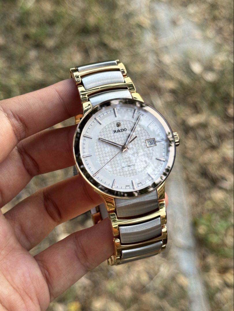 RADO Centrix White Dial Men’s Watch (Category: Luxury Watches) located in Bulacan. Submitted by baywatchesph (Listing ID 1445335403, Image 1). Description: RADO Centrix White Dial Men’s Watch Ref no. R30953123 Automatic movement 38mm case diameter (Men’s size) 80 hours power reserve Sapphire crystal Date display at the 3 o’clock position Water resistance 3 bar (30m) Open-Heart back case Swiss made With box, card, and extra links. 9/10 - Pre-loved