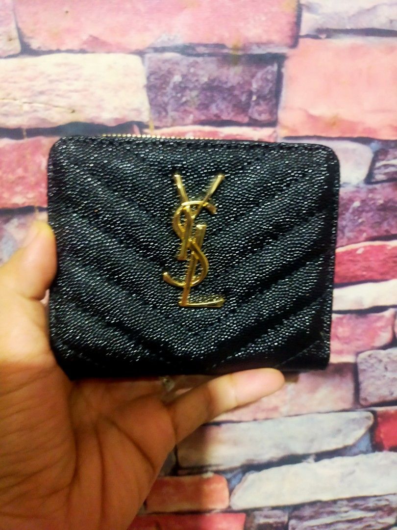Saint Laurent YSL Black Quilted Wallet (Category: Luxury Bags & Wallets) located in Quezon City. Submitted by jham.rose.2026 (Listing ID 1445297914, Image 1). Description: - Authentic Saint Laurent wallet - Iconic gold YSL logo - Elegant quilted chevron pattern - Secure zipper closure - Compact size, ideal for pockets and small bags - Perfect for organizing cards and cash.