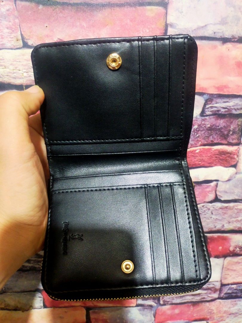 Saint Laurent YSL Black Quilted Wallet (Category: Luxury Bags & Wallets) located in Quezon City. Submitted by jham.rose.2026 (Listing ID 1445297914, Image 2). Description: - Authentic Saint Laurent wallet - Iconic gold YSL logo - Elegant quilted chevron pattern - Secure zipper closure - Compact size, ideal for pockets and small bags - Perfect for organizing cards and cash.