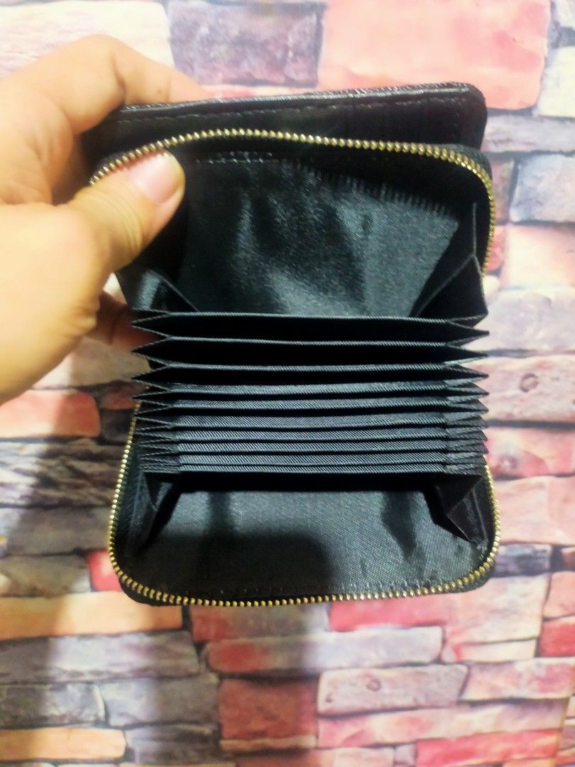 Saint Laurent YSL Black Quilted Wallet (Category: Luxury Bags & Wallets) located in Quezon City. Submitted by jham.rose.2026 (Listing ID 1445297914, Image 3). Description: - Authentic Saint Laurent wallet - Iconic gold YSL logo - Elegant quilted chevron pattern - Secure zipper closure - Compact size, ideal for pockets and small bags - Perfect for organizing cards and cash.